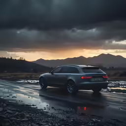 a car is parked on the side of a wet highway with dark clouds