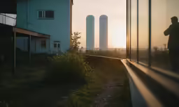 man looking at horizon with the sun setting behind him