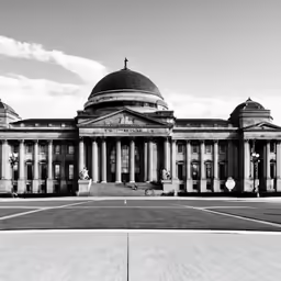 the back of a building with columns in front of it