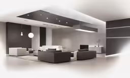 this large room has several modern couches and lamps