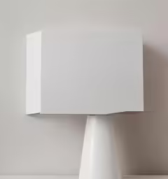 the square object is white and stands on a white pedestal