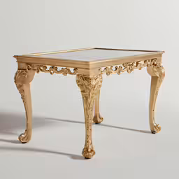 an antique gold table with marble top and decorative legs