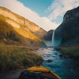 a kayak is parked next to a scenic river