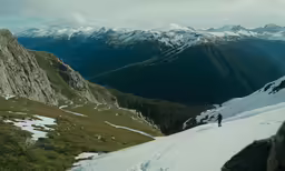 a person on the side of a snow covered mountain