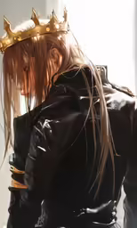 a woman in leather clothes with a golden crown on her head