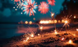 several small fireworks are glowing as they fall off