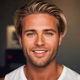a man with blonde hair and blue eyes smiles