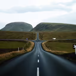 an empty road is seen in the middle of nowhere