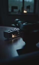 a camera sitting on top of a wooden table