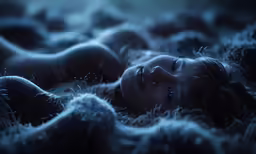 a woman lays on a fur covered bed with her eyes closed