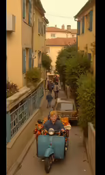 a small motor bike is riding down a narrow road