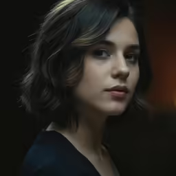 the young woman with a brown hair is looking to the left