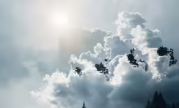 clouds are in the sky and trees are at bottom of them