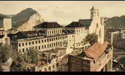 this is an old image of buildings with hills in the background