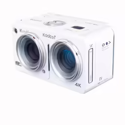 the white digital camera is placed on a table