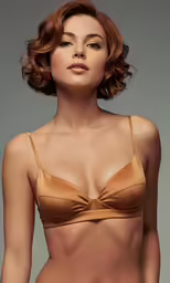 a woman in bikini bottoms posing for the camera