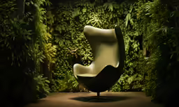 a modern hanging chair with an animal in it