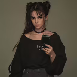 a woman in black shirt with cellphone and hair down