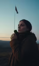 a woman takes a photo on her phone