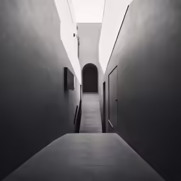 an empty hallway with a long ramp leading to it
