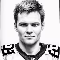 the photograph is in black and white of a male athlete