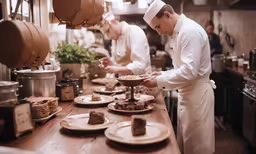 a bunch of cooks are in the kitchen