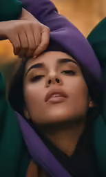 a person that has their hands on her head