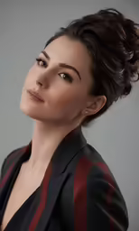 a woman is photographed with her head tilted back to the camera
