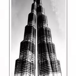 this picture depicts the burj tower in dubai in black and white