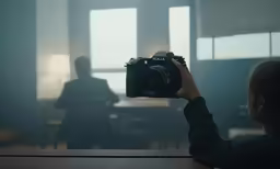 the person is taking a photo with a camera