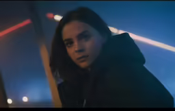 a person standing outside in the dark by night