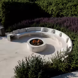circular stone seating area with fire pit in concrete area