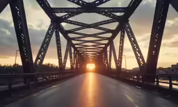 the view from inside the car looking at the sun going down on an asphalt road