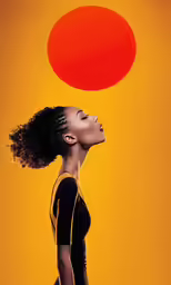 a woman looking up at a large round object