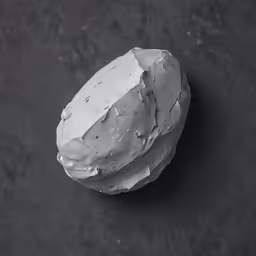 a rock is on top of some black counter