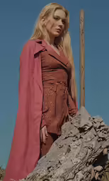 a woman is dressed in a medieval outfit