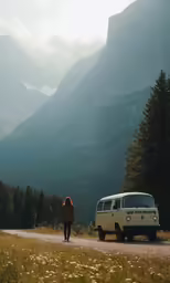 a person walking next to a van on the side of a road