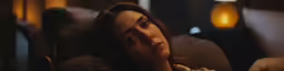 the young woman is sleeping on her couch
