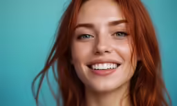 a woman has red hair and blue eyes