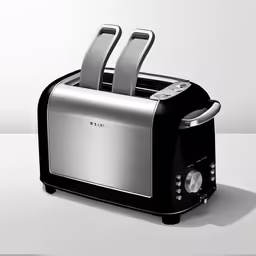 a pair of silver toasters with two metal slices on top