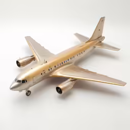 a model jetliner sitting on top of a white table
