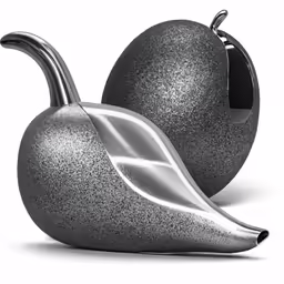 a silver apple sculpture sitting on top of a counter