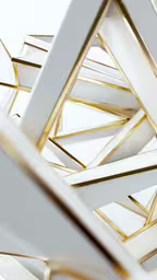 several gold lines on top of a white wall,a white and gold geometric pattern on a table
