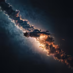 the person is floating in the air with lots of smoke pouring out