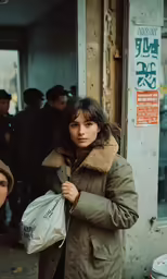 there is a woman standing outside holding a bag