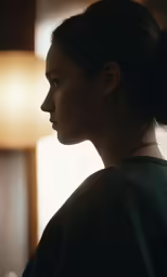 a woman with a bun up in her hair