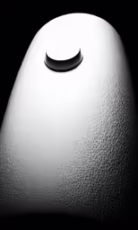 a round light sits on the top of a table