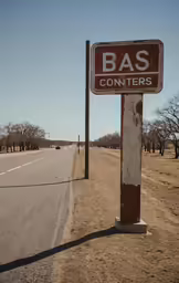 a road with a road sign sitting in front of it