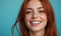 a woman with red hair and blue eyes, wearing pink necklace