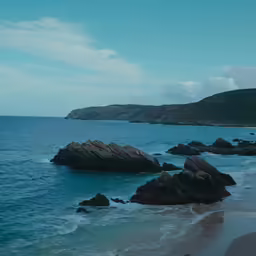 the shoreline is surrounded by rocky, crystal blue water